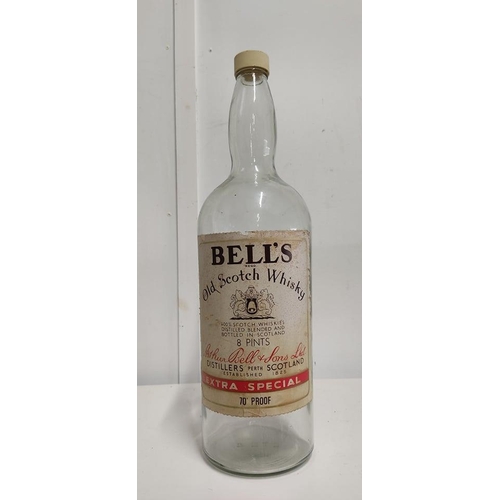 81 - A large vintage Bell's whiskey bottle.