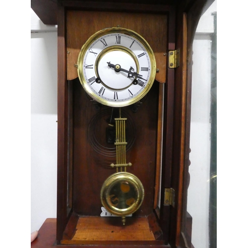 1 - An antique wall clock.