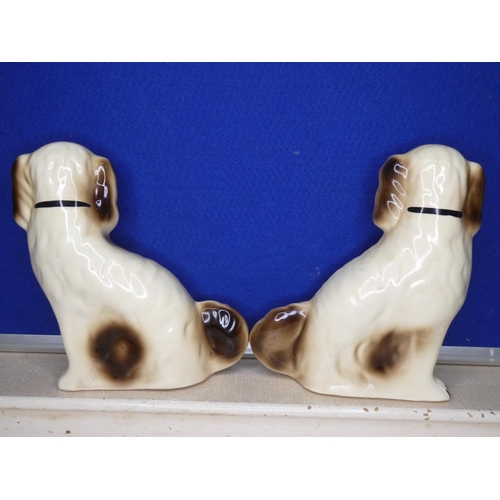 65 - A pair of Staffordshire dogs.