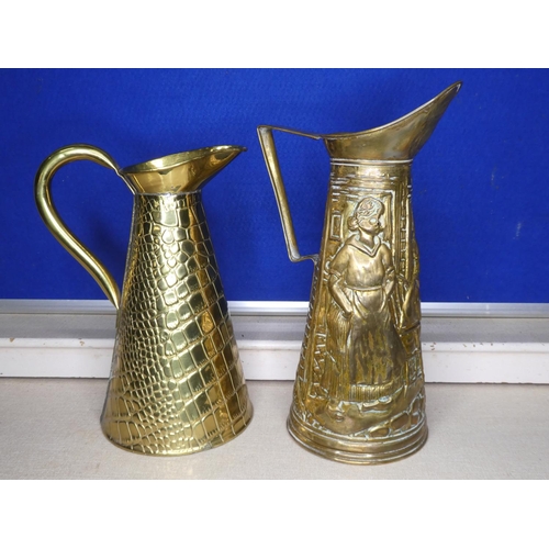 73 - 2 vintage brass jugs.