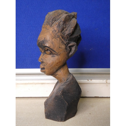 79 - A hand carved wooden bust.