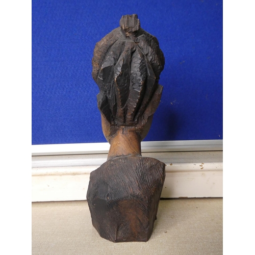 79 - A hand carved wooden bust.