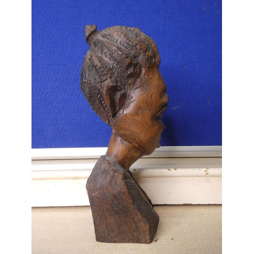 79 - A hand carved wooden bust.