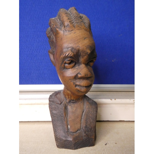 79 - A hand carved wooden bust.