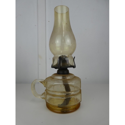 547 - A vintage/ antique clear glass oil lamp.