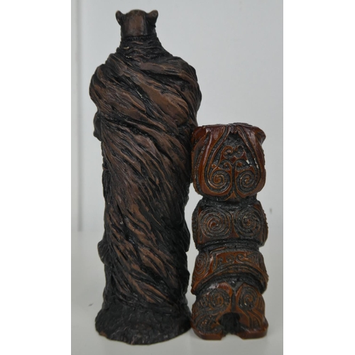 558 - 2 carved resin figures.