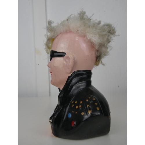 609 - A ceramic 'Punk' moneybox.