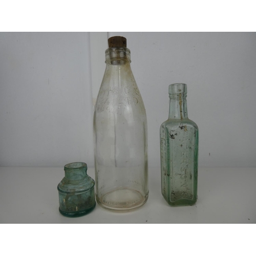 614 - A collection of 3 vintage/ antique glass bottles.