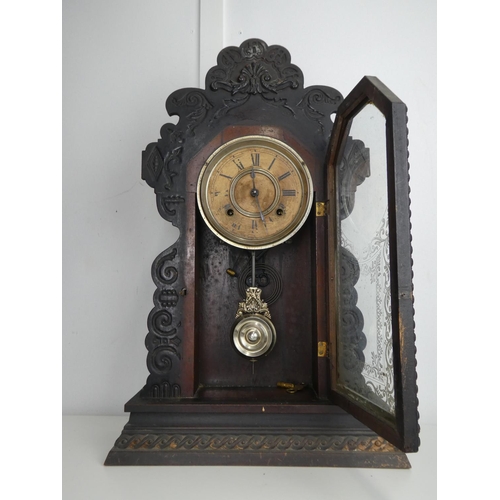 633 - An antique Gingerbread/ schoolhouse clock.