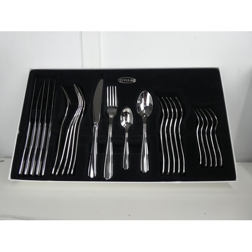 696 - A Stellar 24 piece cutlery set in original box.