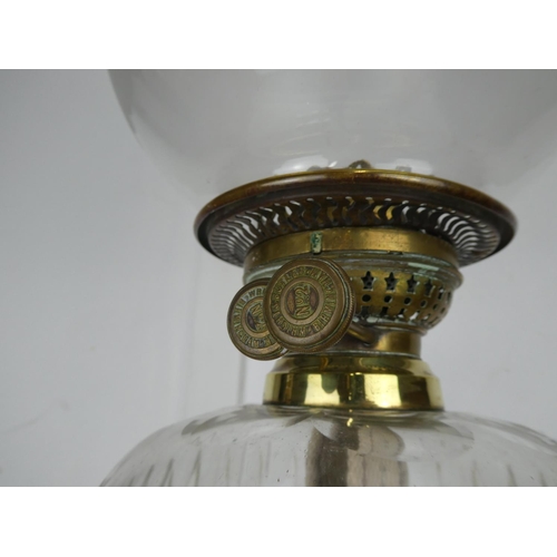 720 - A stunning antique oil lamp.