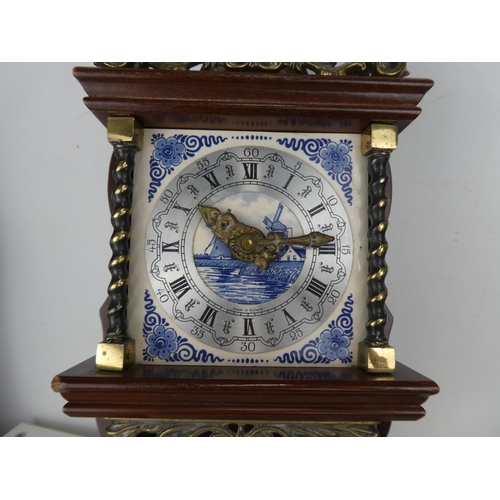 721 - An antique style wall clock.