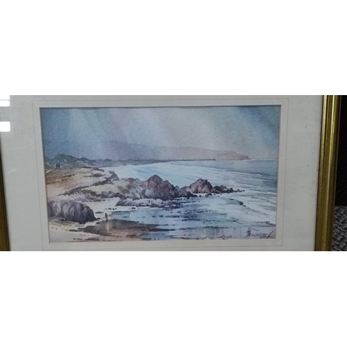 669 - A framed painting of a coastal scene signed by the artist.