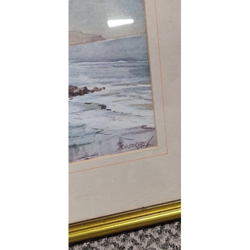 669 - A framed painting of a coastal scene signed by the artist.