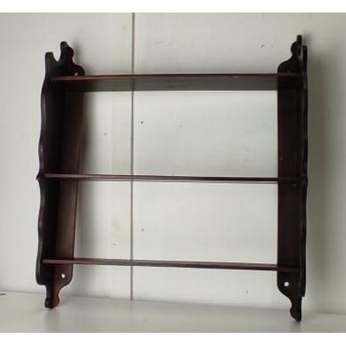 103 - A vintage mahogany shelving unit.