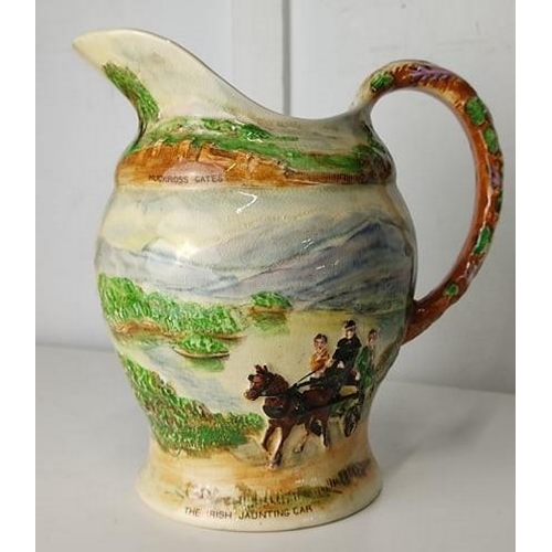 664 - A decorative musical jug from Killarney (a/f).