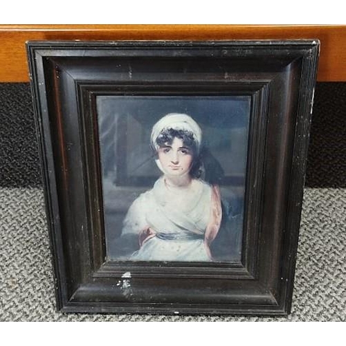 667 - A framed picture of a women.