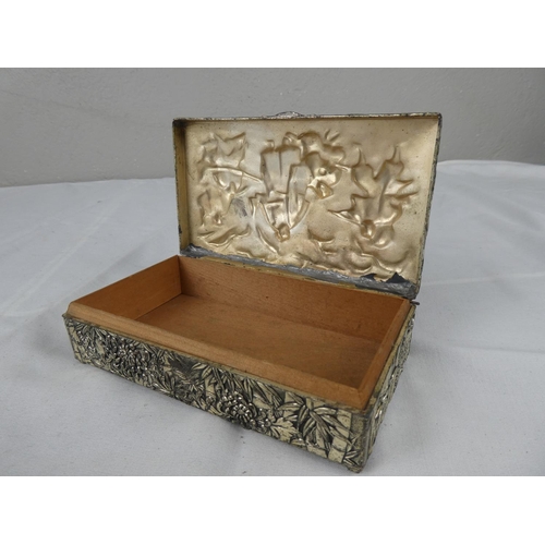 109 - A decorative vintage silver plated cigarette/ trinket box.