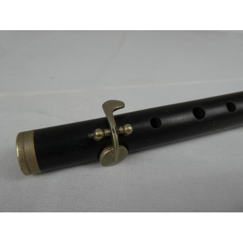 65 - A wooden flute.