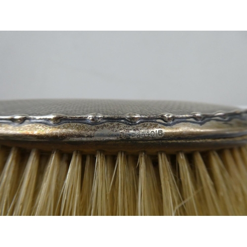 71 - A fully hallmarked set of vanity brushes.