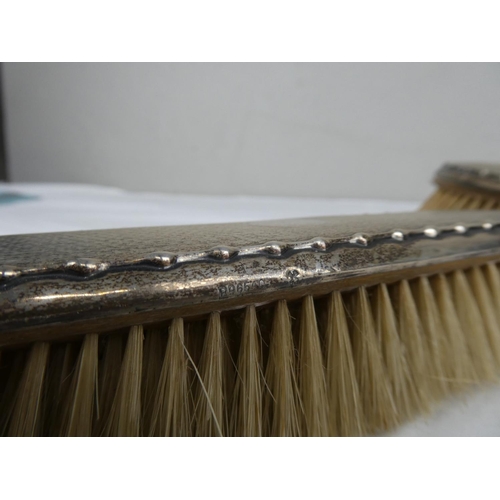 71 - A fully hallmarked set of vanity brushes.