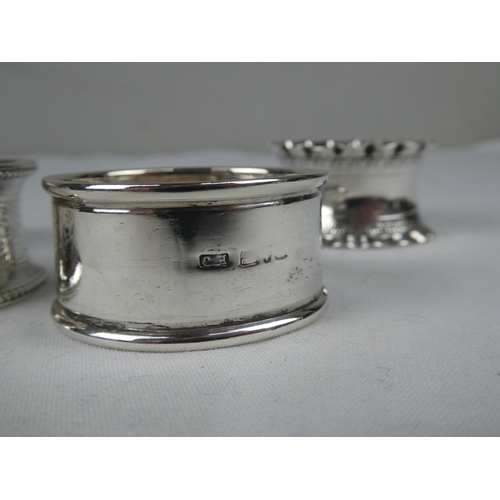 89 - A collection of four Sterling Silver napkin rings.