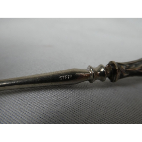93 - A Sterling Silver handled dressing table tool.