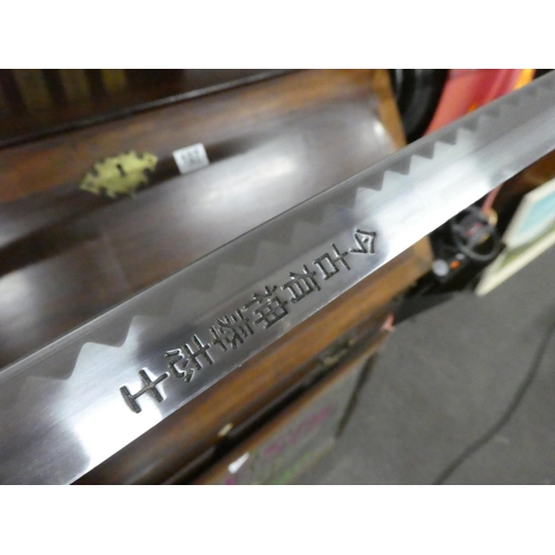 106 - A set of five martial art samurai swords on presentation stand.