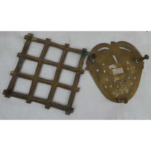 112 - Two brass plate rests.
