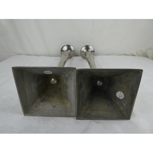65 - A pair of large antique style candlesticks.