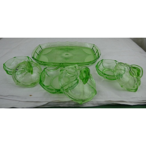 84 - An antique green glass dressing table set.