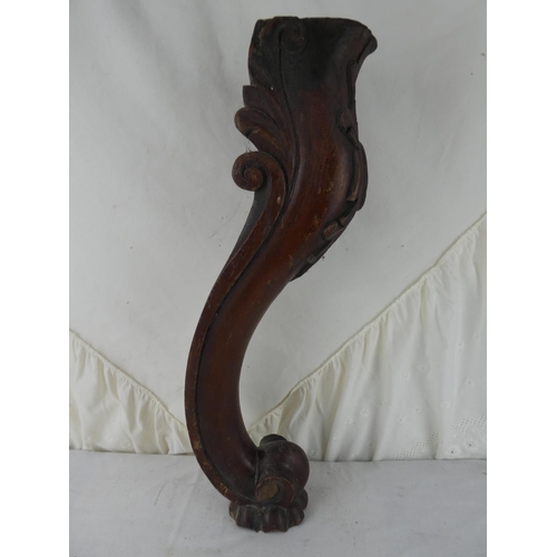 548 - A wooden table leg.
