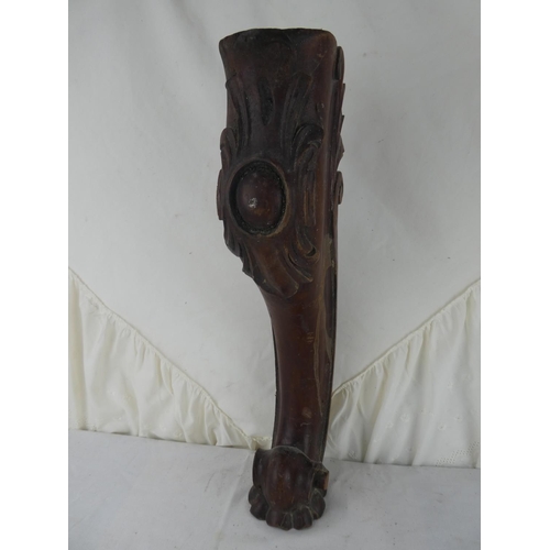 548 - A wooden table leg.