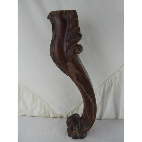 548 - A wooden table leg.
