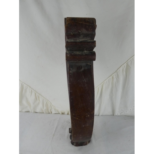 548 - A wooden table leg.