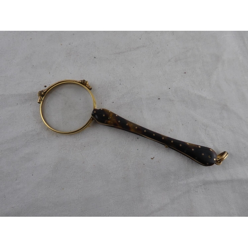 123 - A stunning pair of antique folding spectacles with tortoise shell handle.