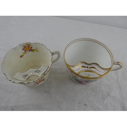 127 - Two antique Gentlemans moustache cups.