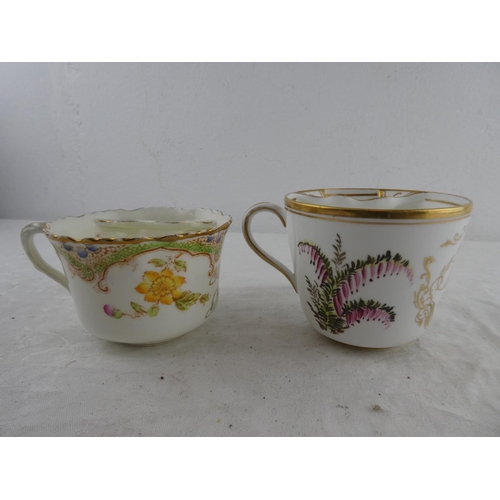 127 - Two antique Gentlemans moustache cups.