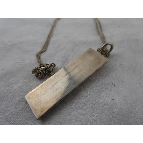 141 - A sterling silver ingot pendant on chain