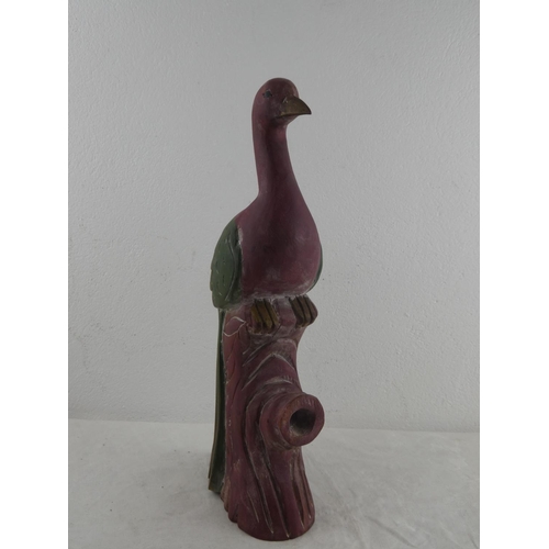 160 - A carved wooden bird.