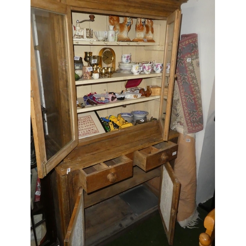 192 - A stunning antique pine two door kitchen cabinet with glass front doors.