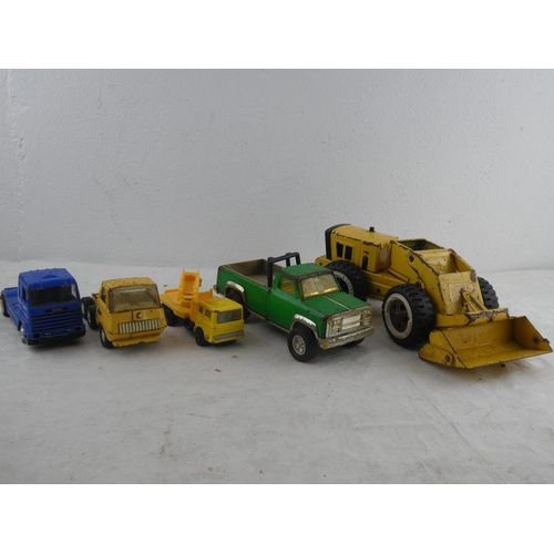 194 - A collection of vintage Tonka trucks and more.