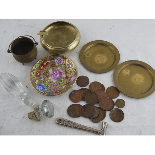 195 - An assortment of items to include coins, decanter stoppers, vintage ashtray and more.