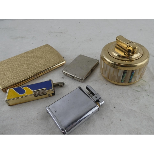 203 - An assorted lot of vintage lighters and cigarette case.