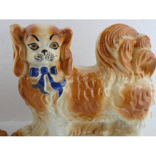 210 - A pair of antique Staffordshire Pekingese dogs.