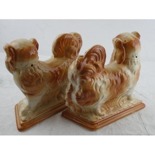 210 - A pair of antique Staffordshire Pekingese dogs.