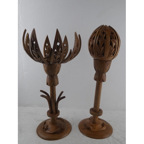 214 - A pair of wooden lotus flower candlesticks.