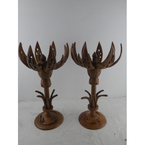 214 - A pair of wooden lotus flower candlesticks.