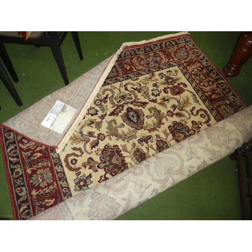 218 - A large decorative floor rug.