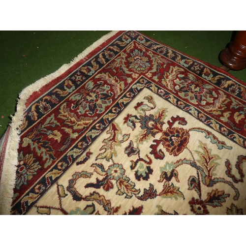 218 - A large decorative floor rug.